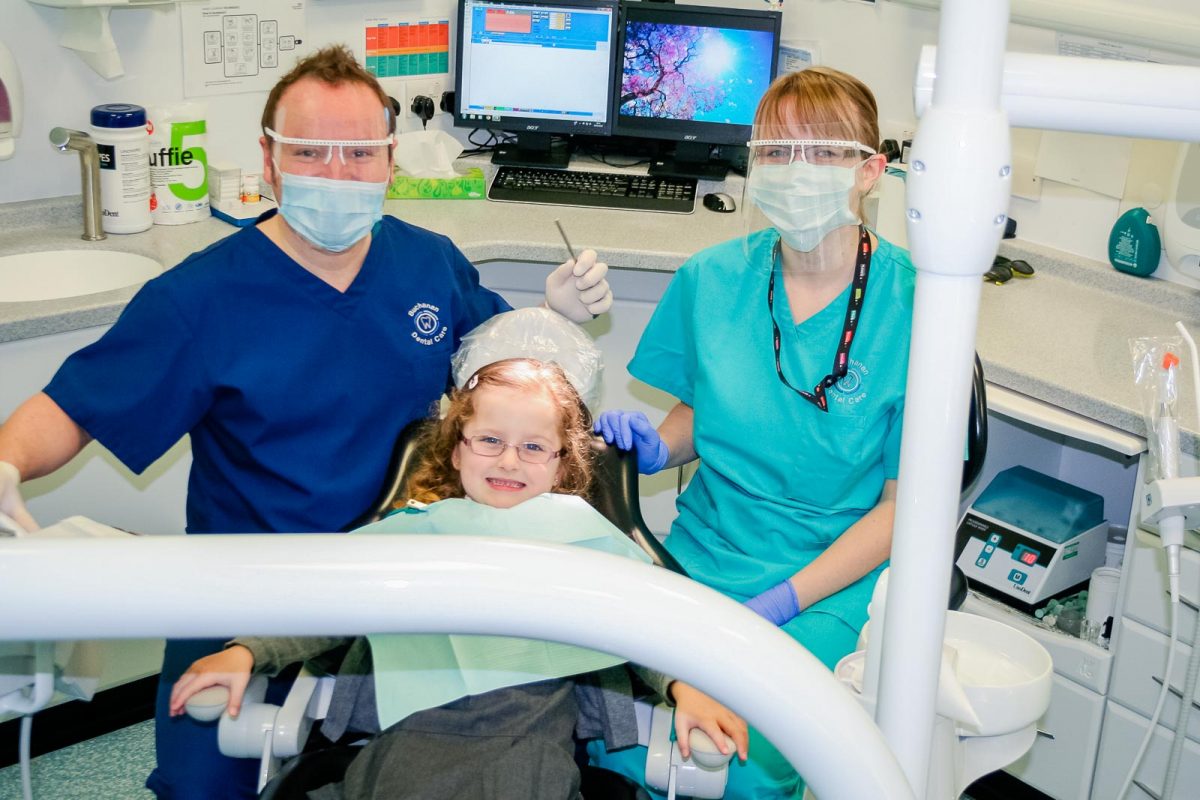 Dentist with Child Patient